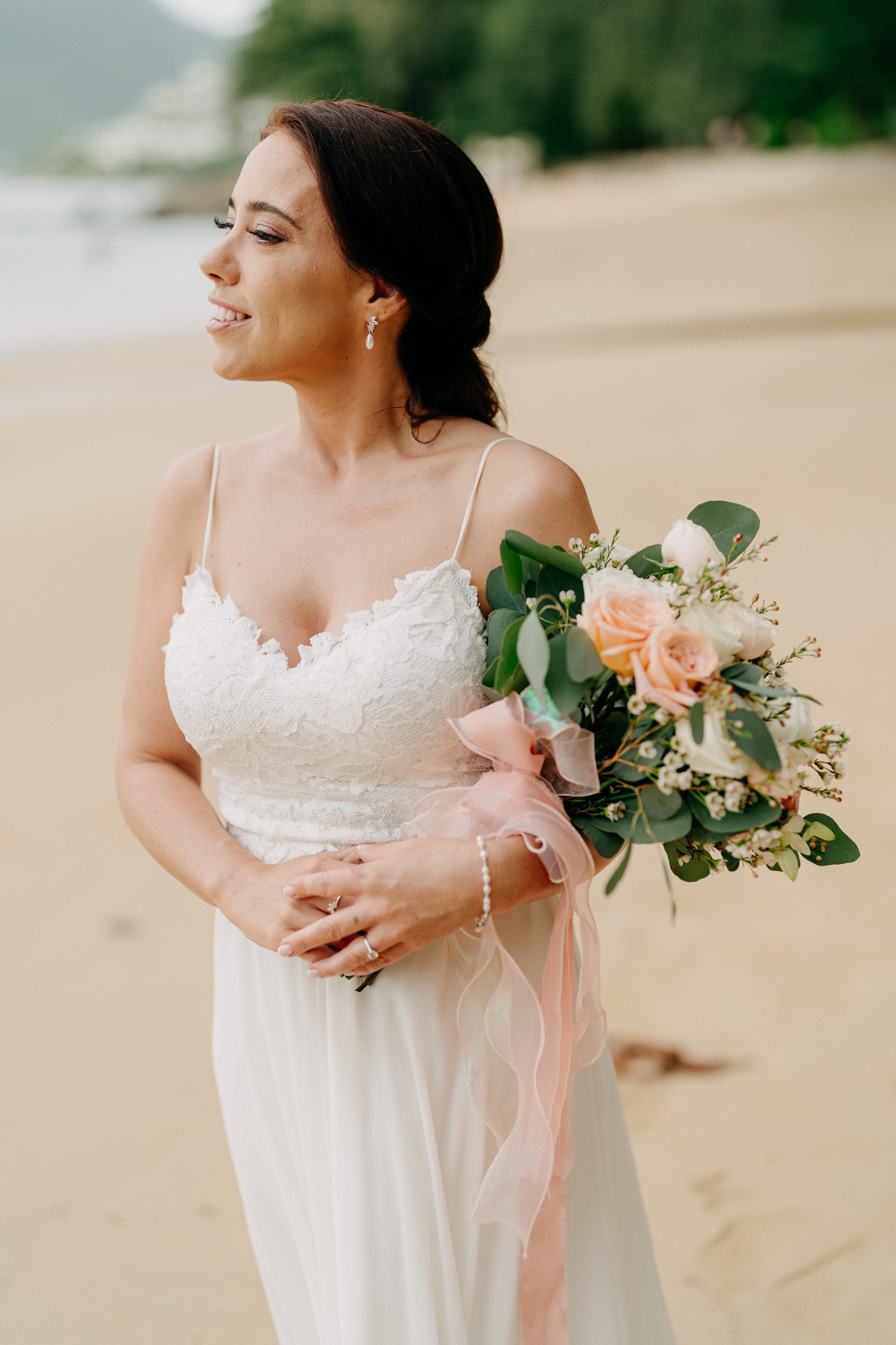 A quiet candid moment with the bride on the beach shortly before her ceremony A quiet candid moment with the bride on the beach shortly before her ceremony