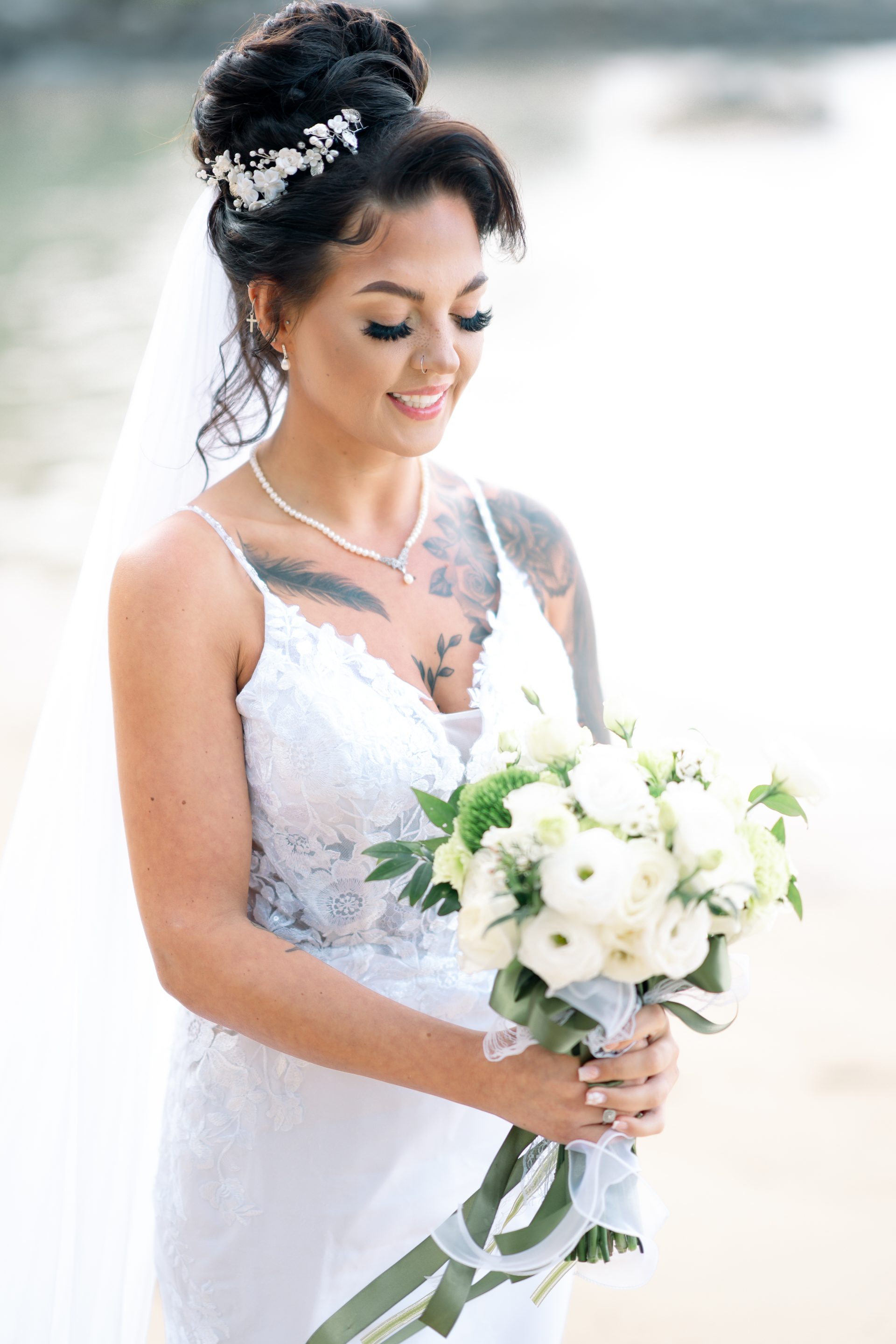 Bride laughing joyfully during her small Phuket beach ceremony