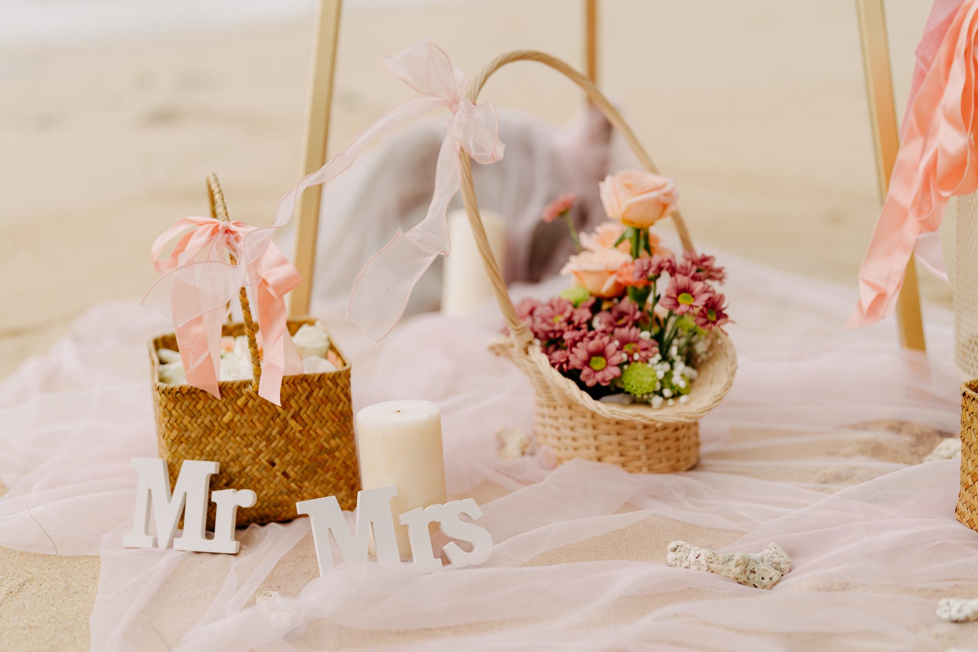 Wooden Mr and Mrs baskets styled at the front of an intimate Phuket beach ceremony